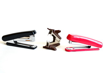 Red and black stapler, staple remover. Isolated. White background.