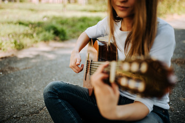 Acoustic guitar playing. Close-up.