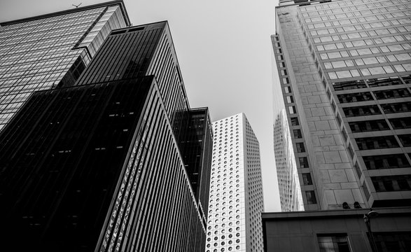 Bottom up view of Modern office building in Hong Kong with B&W color