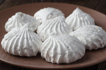 White zephyr marshmallow on porcelain plate