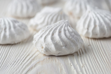 Fototapeta na wymiar French vanilla meringue cookies close up white background.