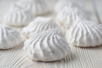 French vanilla meringue cookies close up white background.