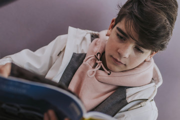 teenage student reading the book or studying