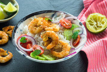 Tandoori prawn skewers with rice and chopped salad - high angle view