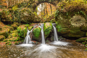 Fototapeta na wymiar Schiessentumpel Waterfall, Mullerthal Trail, Luxembourg