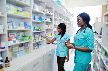 Two african american pharmacist working in drugstore at hospital pharmacy. African healthcare. © AS Photo Family