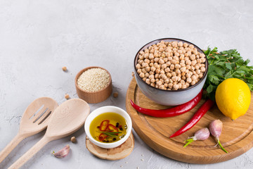 Set of raw ingredients for making hummus. Middle eastern cuisine. Top view Food background with copy space