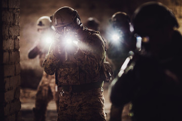 rangers during the military operation with laser sights and lanterns.