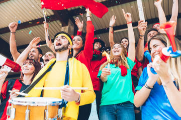 Football fans supporting their team at the arena for the world championship,