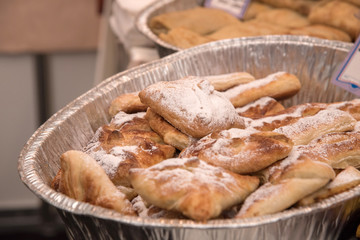 Bakery products. Golden buns on the store shelves sprinkled with sugar