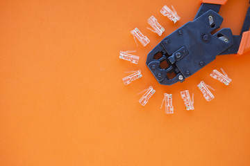 SKS and engineering concept. Set of connectors, ethernet and console cables, crimp tool on the...