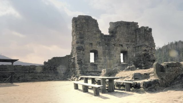 Ruins of medieval castle. Scary giant building, huge defensive fortification tower and bulwark. Spring sunny day, without people. Oybin in Germany.
