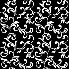 Floral seamless pattern. White swirls and foliage isolated on a black background. Ideal for textile print and wallpapers.