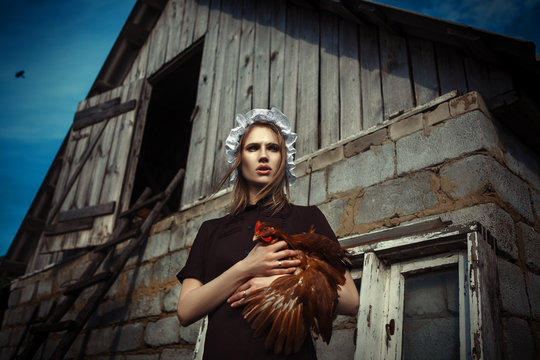Amish styled model is posing with animals