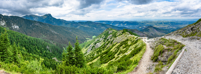 Naklejka na ściany i meble Panorama of mountains, hiking trail and valley in Tatras, Poland