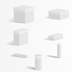 A set of white boxes with lids on a light background
