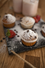 Obraz na płótnie Canvas chocolate muffin strawberry milkshake