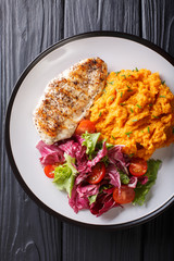 Healthy food: grilled chicken fillet with mashed potatoes and fresh salad closeup. Vertical top view