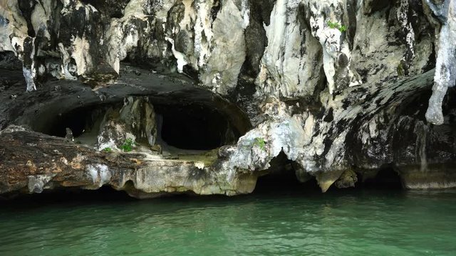 stalactites at the foot of islands in the ocean.