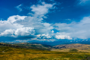 Naklejka premium Mountain landscape with clouds. Mountain valley. The Altai mountains. Travel adventure vacation background