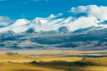 Mountain landscape with clouds. Mountain valley. The Altai mountains. Travel adventure vacation background