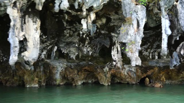 stalactites at the foot of islands in the ocean.