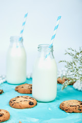 Cookie chocolate with a milk bottles.