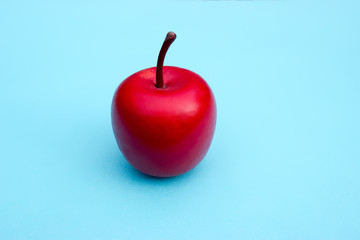 Decoration - red apple on a blue background