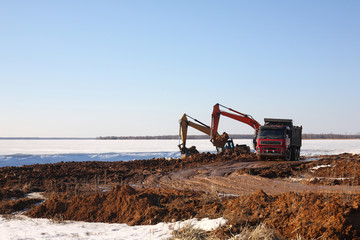 Construction - Two excavator behind dump truck work