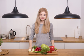 Young woman preparing breakfast in the kitchen