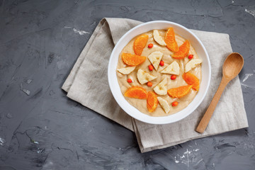 Delicious mandarin, banana, seed of flax, seabuckthorn bowl Smoothie