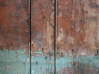 wooden plank background. Worn green paint.