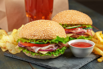 Fast food, homemade burger on a wooden background