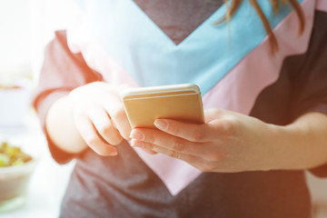 Woman typing write message on smart phone