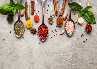 Different kind of spices in vintage spoons