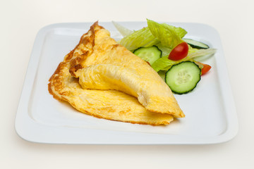 Omelet with vegetables isolated on white. Top view