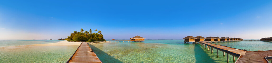Fototapeta na wymiar Bungalows on tropical Maldives island