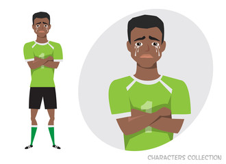 The black african american football player crossed his arms and cries. Mans tears and depression. The emotion of disappointment and sadness at the soccer player face. The male was crying