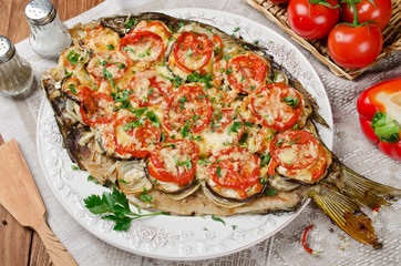Grilled fish with vegetables and cheese