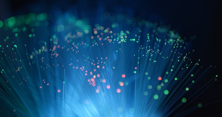 Optical fiber light over black background