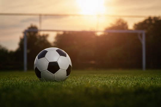 Soccer ball in the sunset
