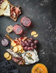 Delicatessen plate and wine