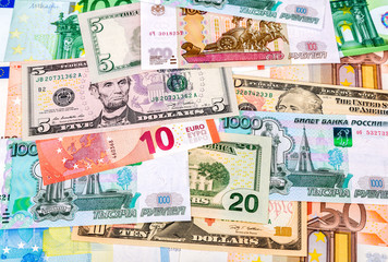 Money background from different paper currency of euro, american dollars and russian rubles