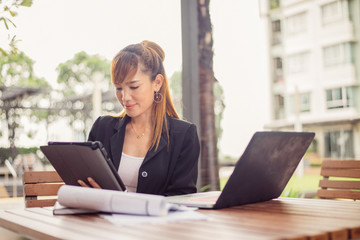 Vintage style, Smiling young business woman thinking in the office