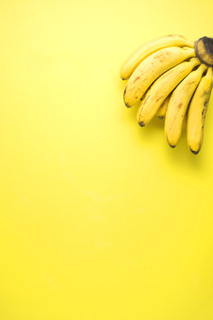 Banana on yellow / Creative concept photo of bananas on yellow background.
