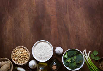 Chinese food raw ingredients, vegetables and nuts. Wooden background