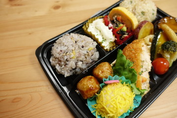 Japanese style obento (rice plate) with varieties of dishes.