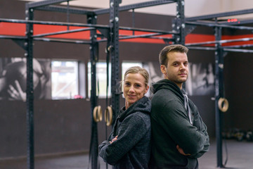 Athletic man and woman facing to the camera