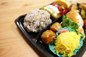 Japanese style obento (rice plate) with varieties of dishes.