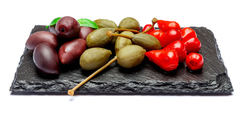 Mixed Pickles on stone serving board. Olives, Capers and peppers